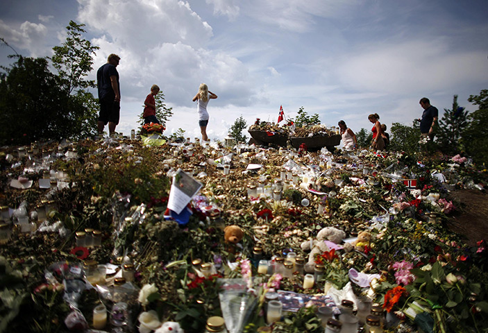 24 hours in pictures: Memorial on the shore of Tyrifjorden lake overlooking Utoeya island