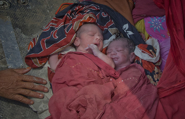 FTA: Adrees Latif   : Newborn twins after they were evacuated from their flooded village