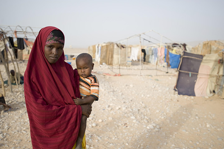 Puntland Somalia : Norta Omar, 26 with her youngest child Faisal Kasim, two