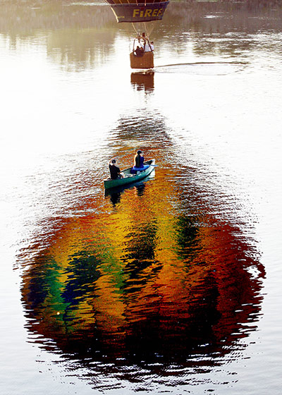 24 Hours:  pilot dips the basket of his hot-air balloon in the Androscoggin River