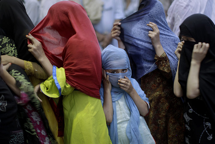 24 Hours: A Pakistani girl queues up to receive a donated meal in Rawalpindi