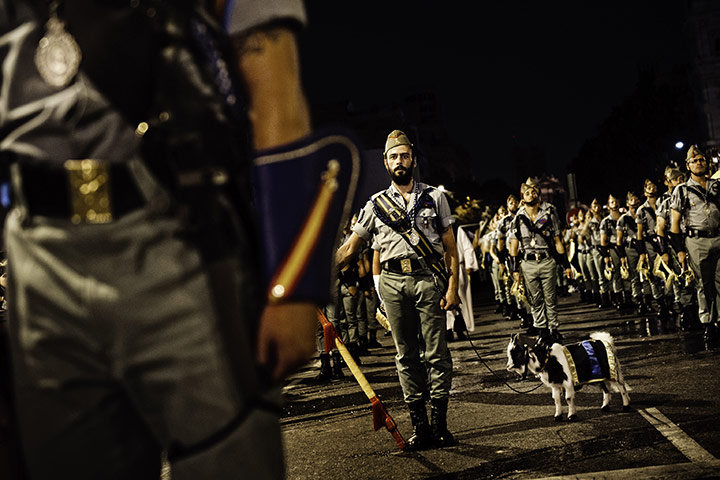 24 Hours: Soldiers with a goat after a religious ceremony celebrated with the Pope