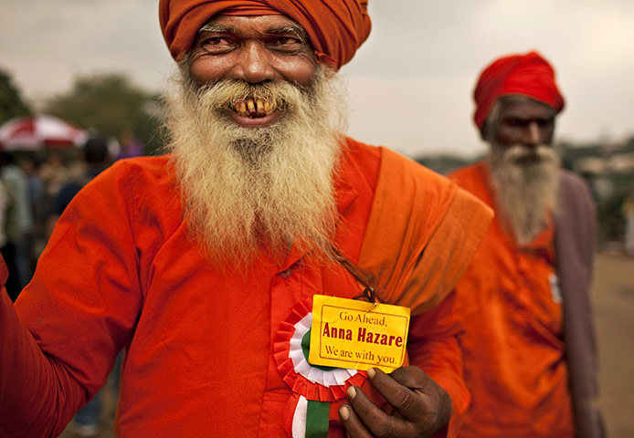 24 hours in pictures: New Delhi, India: A Hindu holy man loyal to Anna Hazare shows his support