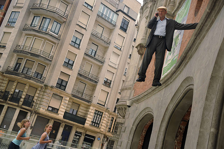 24 hours in pictures: Bilbao, Spain: German street artist Johan Lorbeer performs