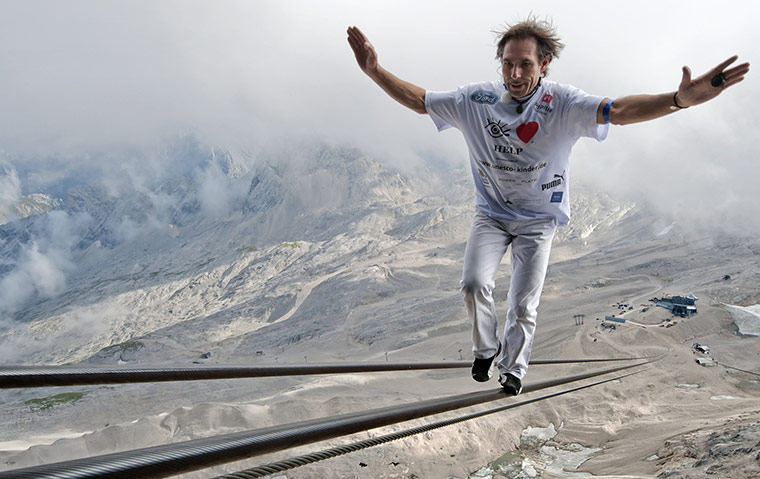 24 hours in pictures: Grainau, Germany: High wire artist Freddy Nock balances 