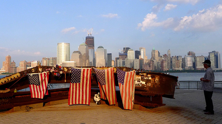 24 hours in pictures: Jersey City, New Jersey, USA: A man looks at a twisted piece of steel 