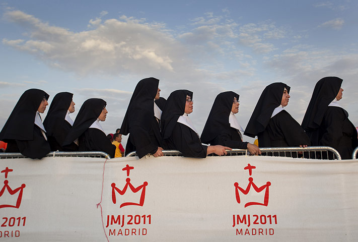 24 hours in pictures: Madrid, Spain: Nuns wait for the Pope Benedict XVI