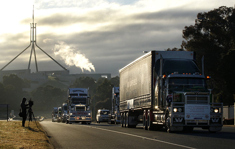 24 hours in pictures: Canberra, Australia: A convoy of lorries protesting against carbon tax