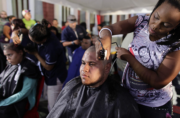 24 hours in pictures: Caracas, Venezuela: People have heads shaved in solidarity with Chavez