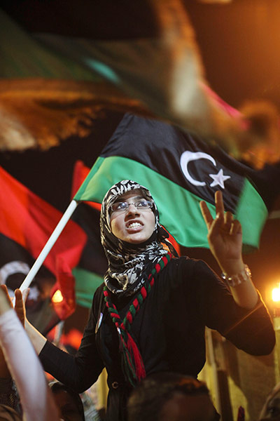 Muammar Gaddafi Libya : A woman celebrates at the rebel held town of Benghazi, Libya