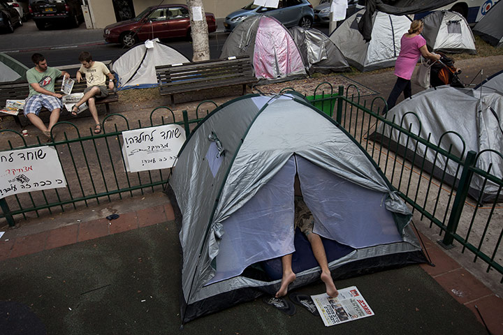 FTA: Oded Balilty: An Israeli protester sleeps  in a protest tent encampment