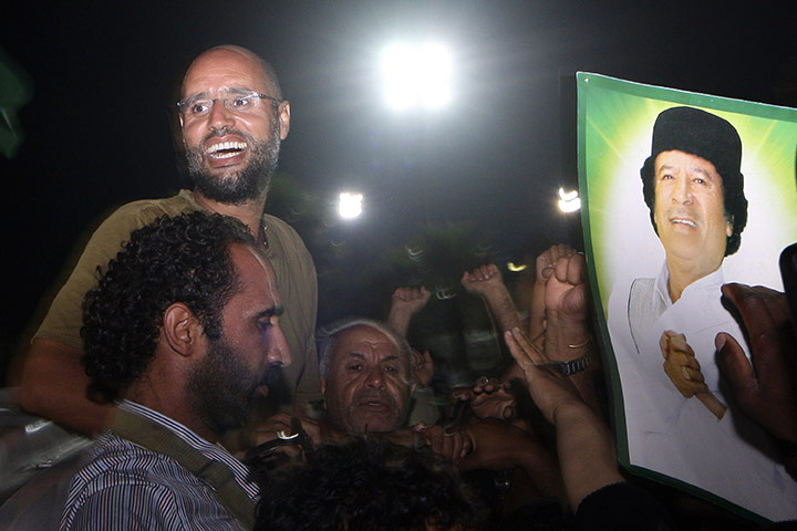 Battle for Tripoli: Muammar Gaddafi's son, Saif al-Islam gestures to loyal troops