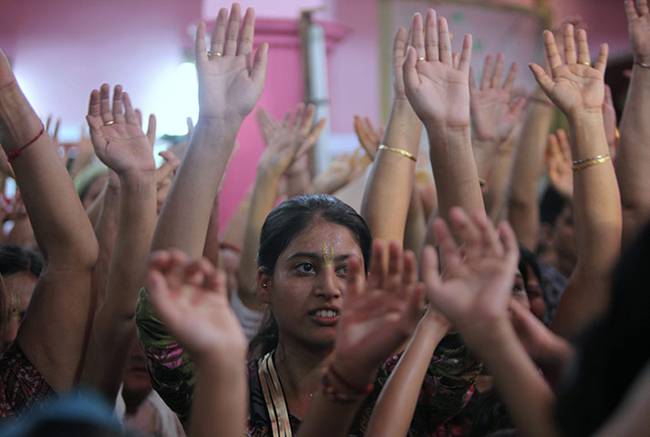 Krishna festival: Jammu, India: People dance as they worship at Iskon temple