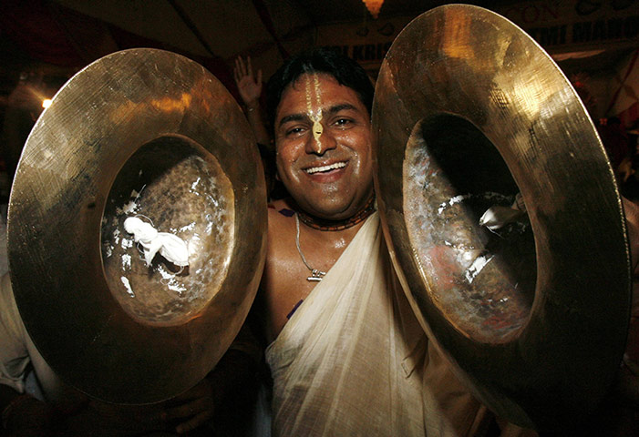 Krishna festival: Chandigarh, India: A Hindu devotee plays cymbals and dances
