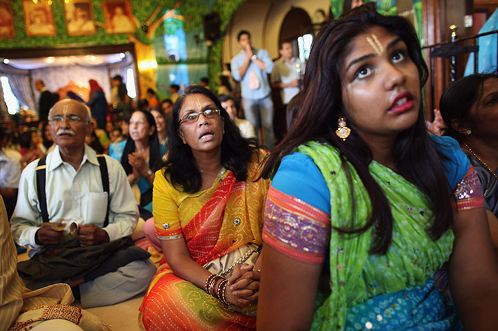 Krishna festival: Watford, England: People pray inside a temple at the Janmashtami Hindu