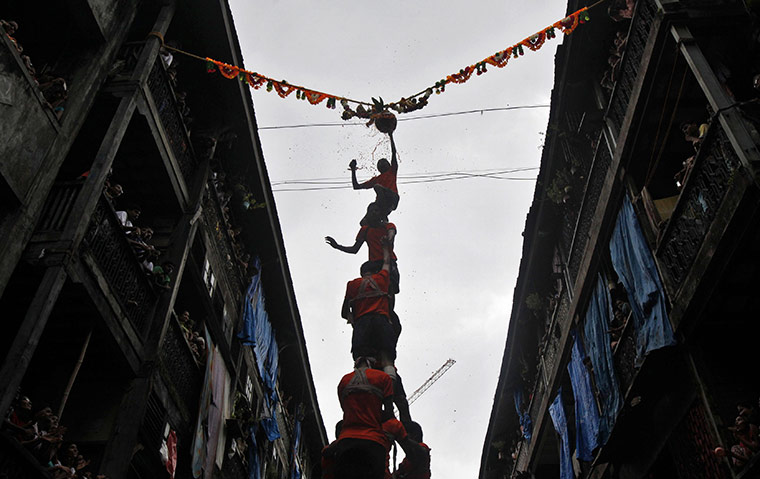 Krishna festival: Mumbai, India: Indian youth make a human pyramid