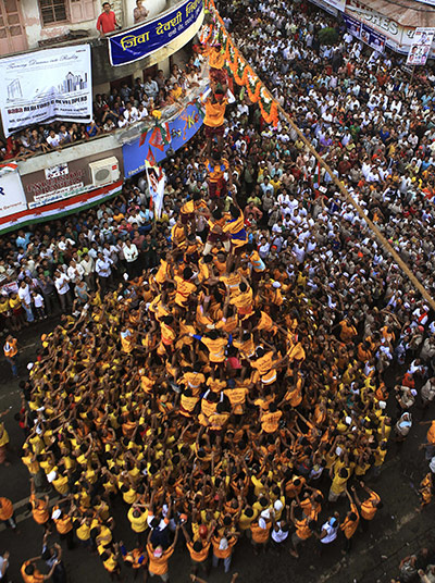 Krishna festival: Mumbai, India: Indian youth make a human pyramid