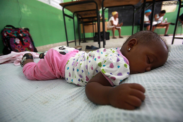 Hurricane Irene: A baby sleeps in a school converted into a shelter 