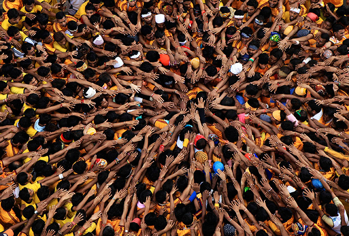 24 hours in pictures: Indians reach and break the Dahi Handi, Mumbai, India