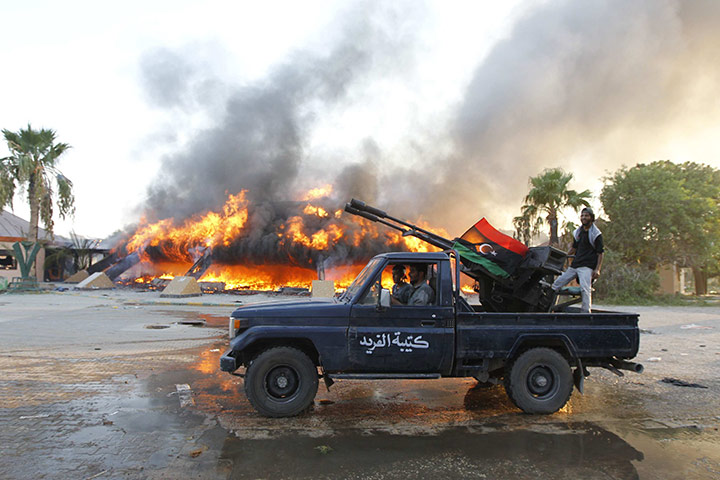 Gaddafi's compound falls: Libyan rebels celebrate at the Bab al-Aziziya compound in Tripoli