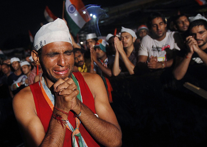 24 hours: New Delhi, India: A supporter of veteran social activist Anna Hazare cries