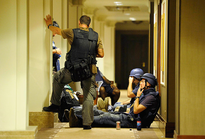Media in Rixos hotel: Members of the media gather in a corridor at the Rixos hotel in Tripoli