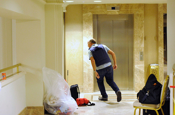 Media in Rixos hotel: A member of the media runs, Rixos Hotel, Tripoli