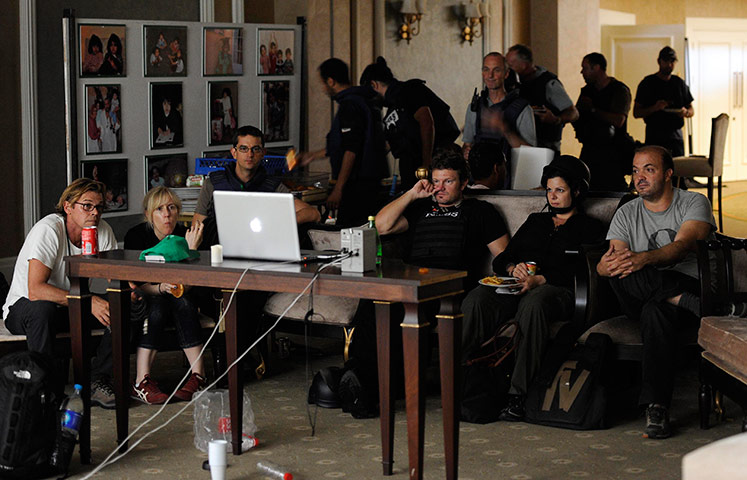 Media in Rixos hotel: Members of the media watch a film in the basement Rixos Hotel, Tripoli