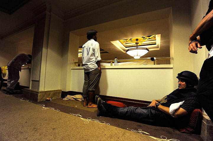Media in Rixos hotel: Members of the media waits in a corridor at the Rixos hotel in Tripoli