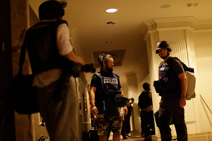 Media in Rixos hotel: Journalists gather as gun-battles continue around the Rixos hotel 