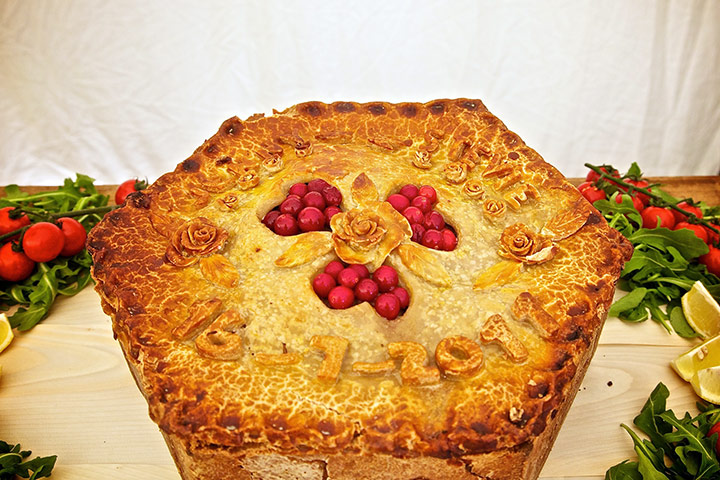 Week in pics: Rob da Bank: pork-pie wedding cake