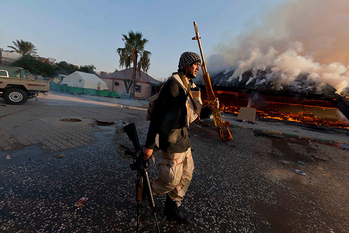 Sean Smith in Tripoli: A rebel fighter displays a looted golden gun, Bab al-Aziziya, Tripoli