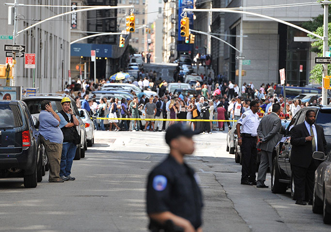 US earthquake: Officer stands guard for safety on a street in Lower Manhattan