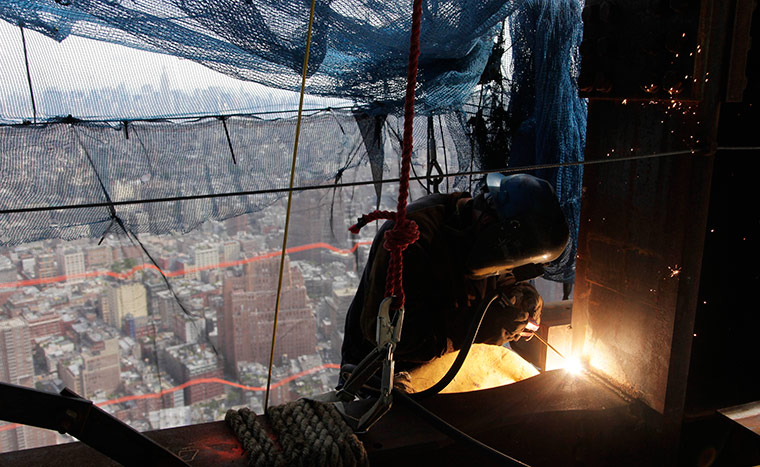 24 hours in pictures: A welder works on an upper floor of One World Trade Centre