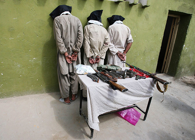24 hours in pictures: Three captured Taliban insurgents in Ghazni province