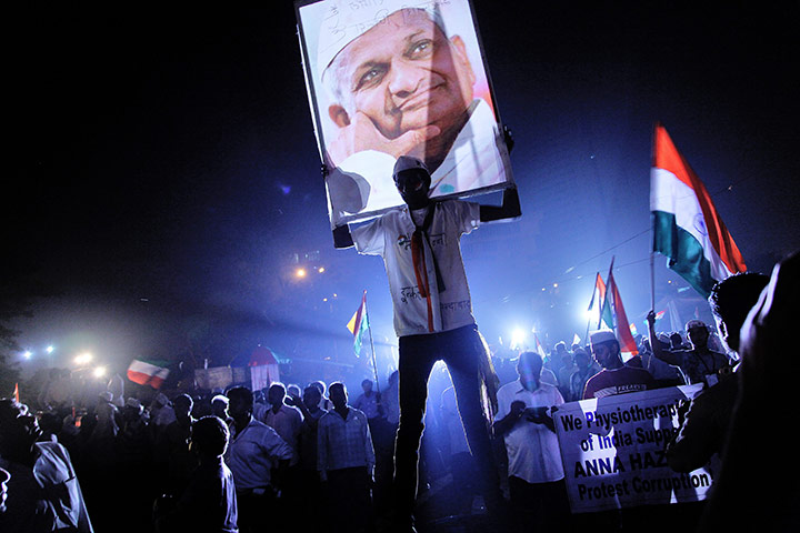 24 hours in pictures: An Indian supporter of Indian veteran social activist Anna Hazare