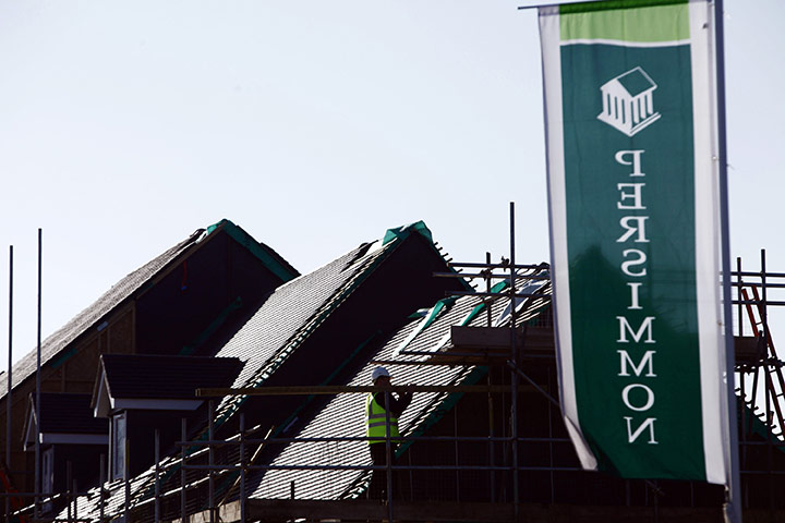 Week in Business: A builder works on a property for Persimmon plc in Swindon