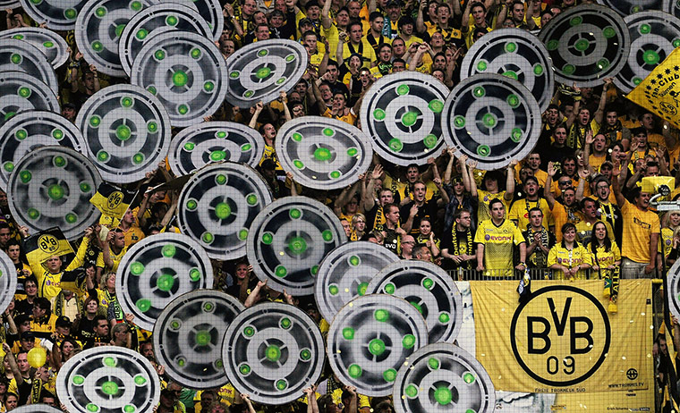 Champions League Draw: Dortmund's supporters cheer prior to the match against Hamburger SV