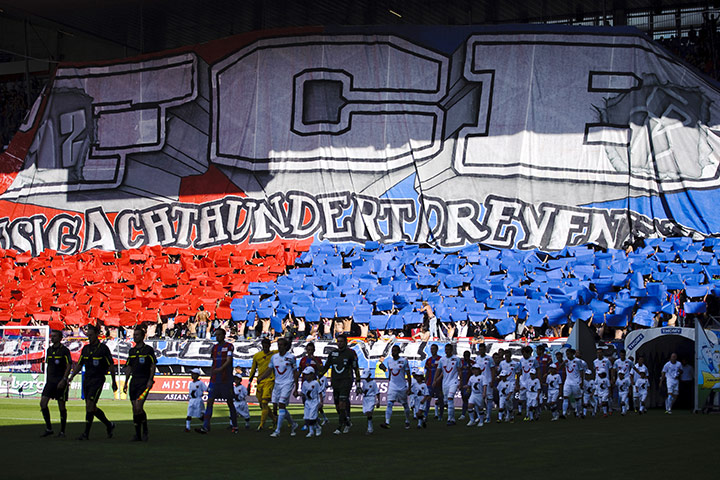 Champions League Draw: The teams take to the field infront of the FC Basel 1893 supporters
