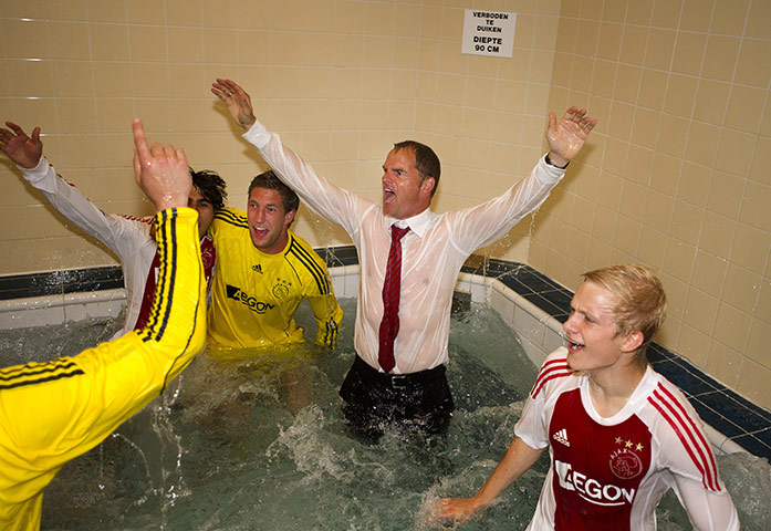 Champions League Draw: Ajax coach Frank de Boer (C) celebrates winning the Dutch league title 