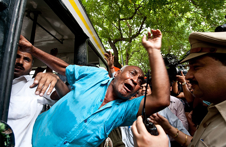 24 hours in pictures: ndian policemen detain supporters of anti-corruption activist Anna Hazare