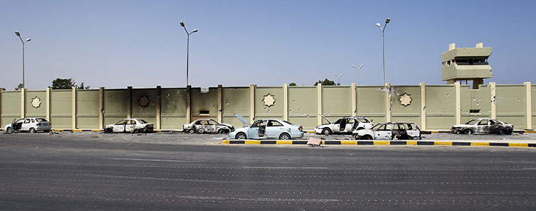 24 Hours: Destroyed cars parked next to Moammar Gadhafi's compound Bab al-Aziziya