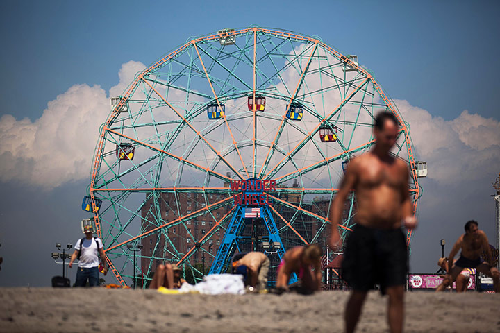 24 Hours: People at Coney Island experience sunny weather as Hurricane Irene nears