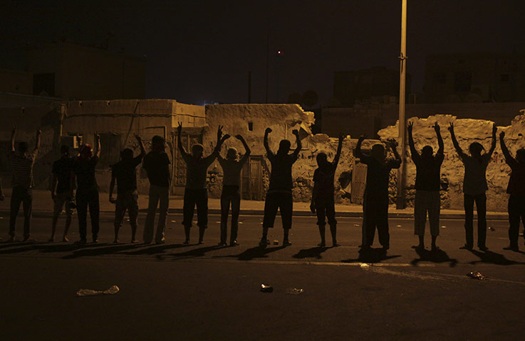 24 Hours: Masked Bahraini youths gesture and shout anti-government slogans