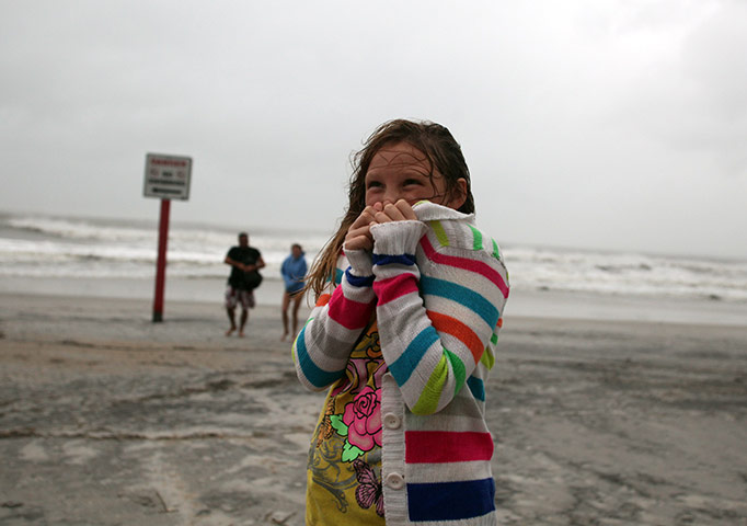 Irene Hurricane: Rhiannon Shaw, 9, tries to stay warm as Hurricane Irene passes through