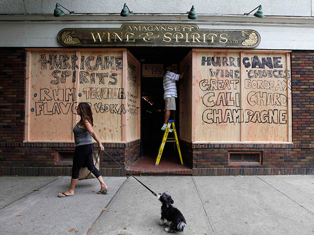 Hurricane Irene: An employee boards up the windows of a store in Amagansett, North Carolina