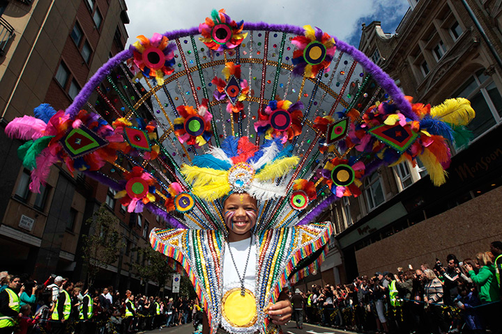 Notting Hill carnival: A performer dances in the street parade, Notting Hill Carnival