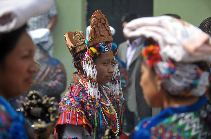 24 hours: Sumpango, Guatemala: A Beauty Queen attends the procession of San Agustin