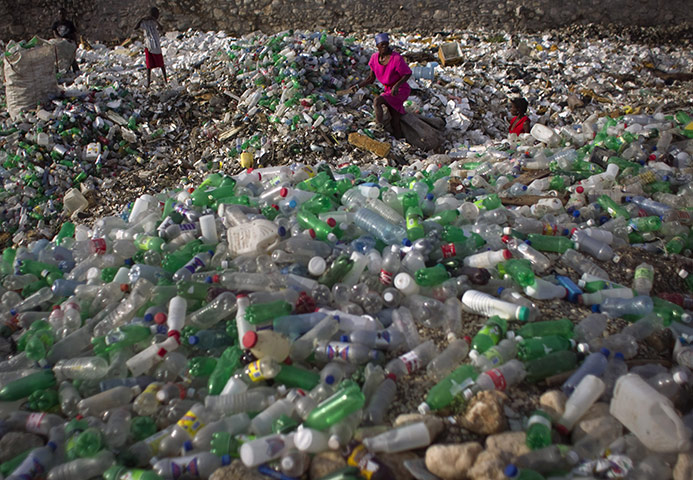 24 hours: Port-au-Prince, Haiti: People search for items to sell through rubbish