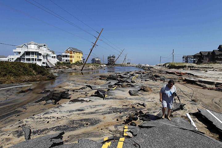After Hurricane Irene: Residents walk along destroyed Highway 12, in Rodanthe